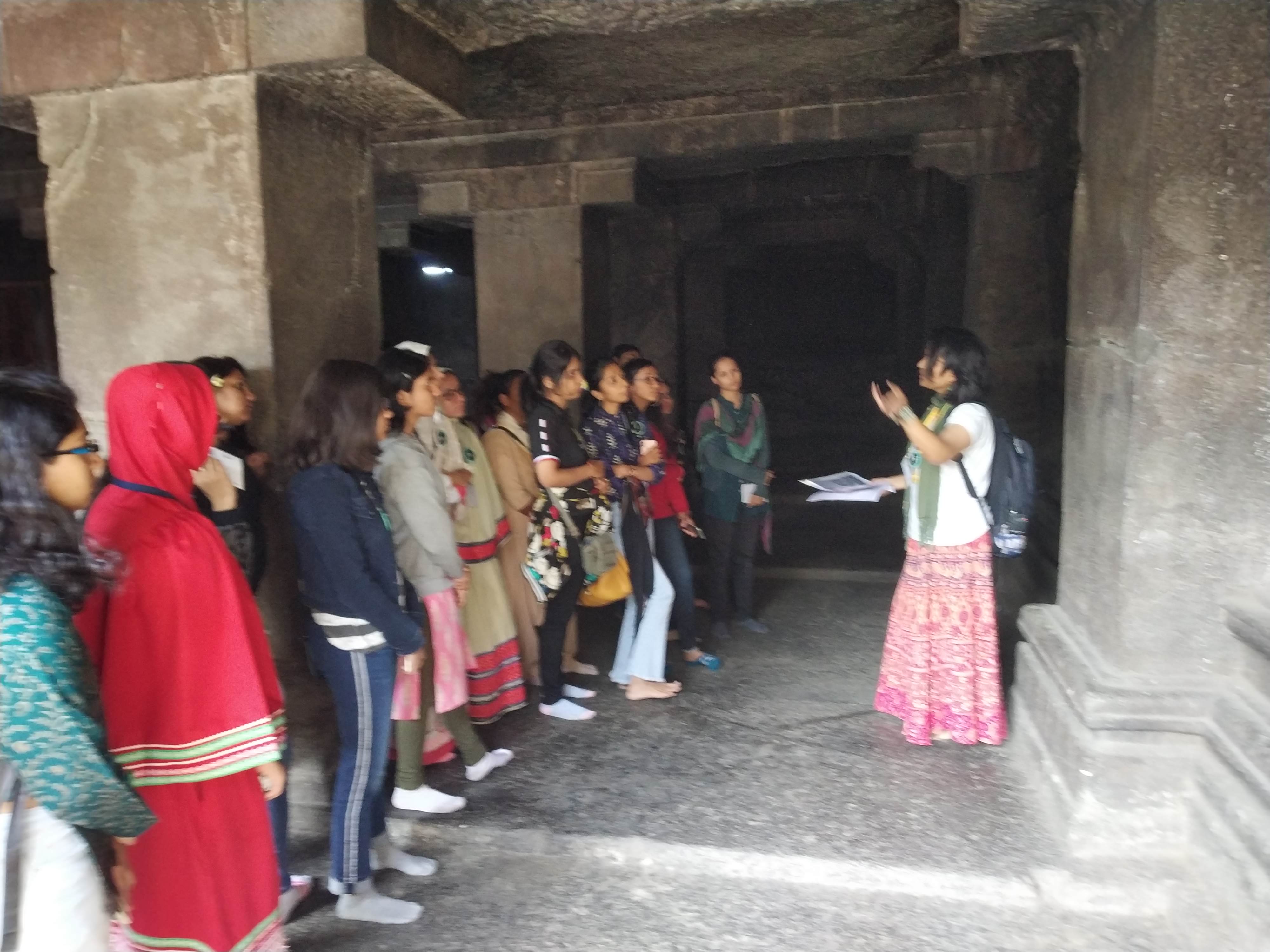 Heritage Walk Pataleshwar Caves Sculpture on the Wall being explained Dept. of History